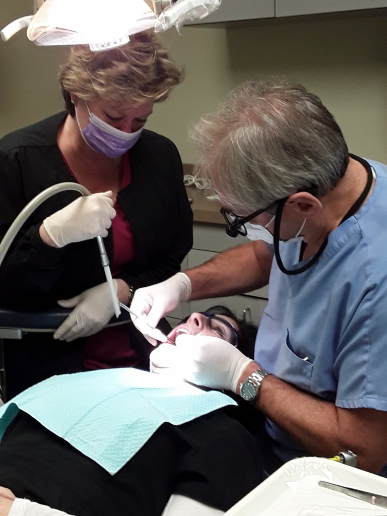 Dr Kiesel performing a dental procedure